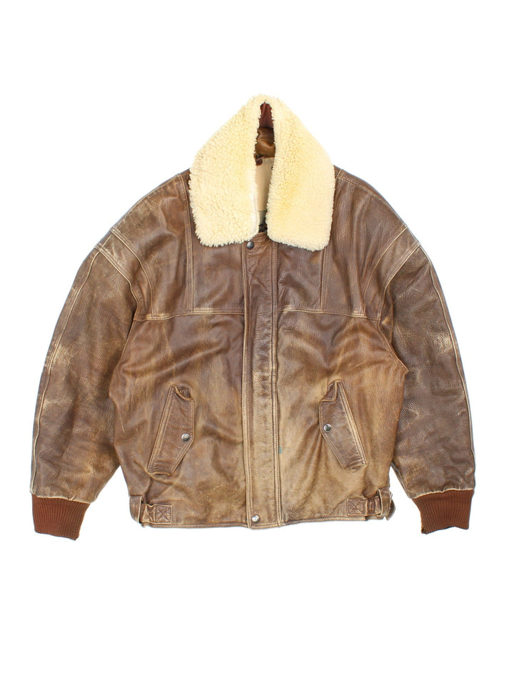 Vintage Leather Flight Bomber Jacket in a brown colourway. Full zip with button pockets on front and interior pockets, also has embroidered logo on the inside.