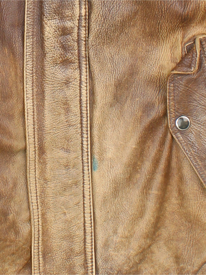 Vintage Leather Flight Bomber Jacket in a brown colourway. Full zip with button pockets on front and interior pockets, also has embroidered logo on the inside.