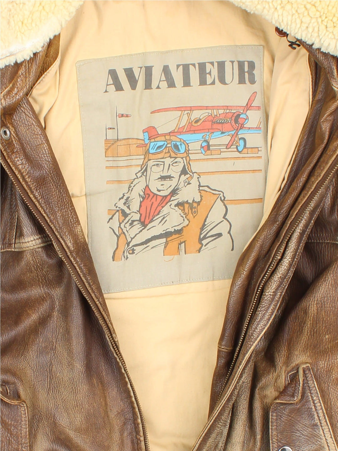 Vintage Leather Flight Bomber Jacket in a brown colourway. Full zip with button pockets on front and interior pockets, also has embroidered logo on the inside.