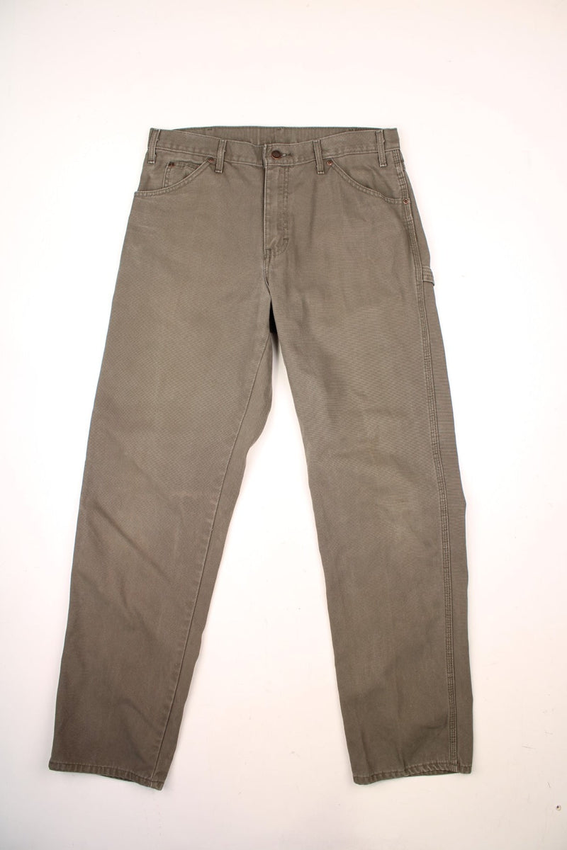 Dickies khaki green carpenter jeans with multiple pockets and logo on the back pocket