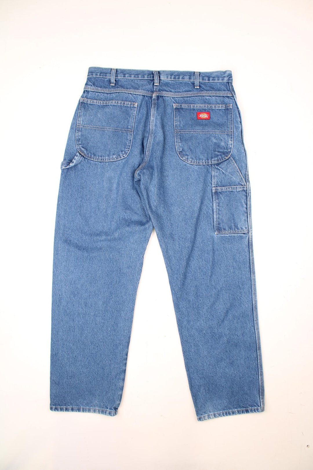 Dickies medium wash carpenter jeans featuring multiple pockets 