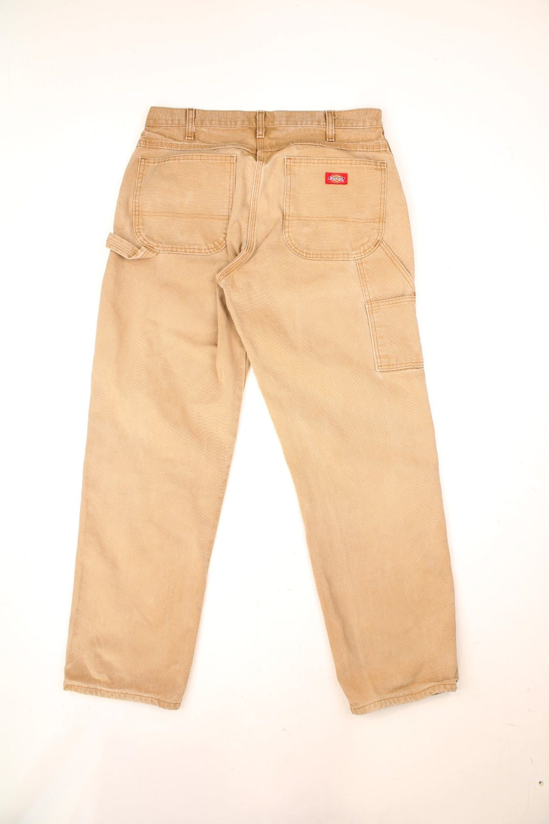 Dickies tan carpenter jeans with multiple pockets and logo on the back pocket