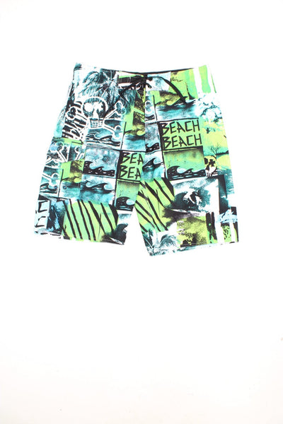 Y2K Billabong Beach Shorts in a surf patterned green, blue and white colourway, has an adjustable waist, and only has 1 cargo style pocket. 