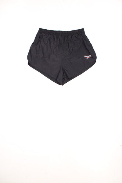 Vintage Reebok Running Shorts in a black colourway, has an adjustable waist, cotton lining, no pockets, and has the logo embroidered on the front. 