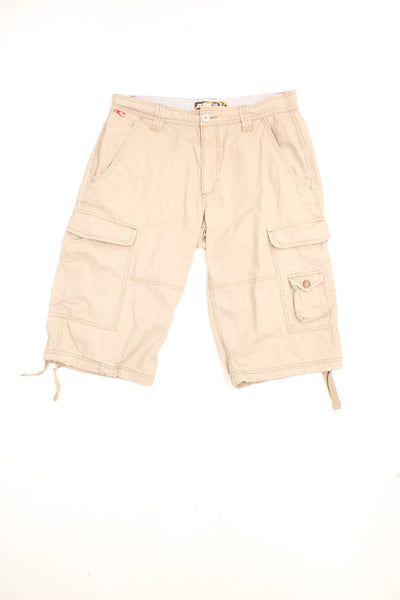 Vintage O'Neill Cargo Shorts in a tanned colourway, has multiple pockets, adjustable cuffs at the bottom, and has the logo graphic printed on the back by the left pocket. 