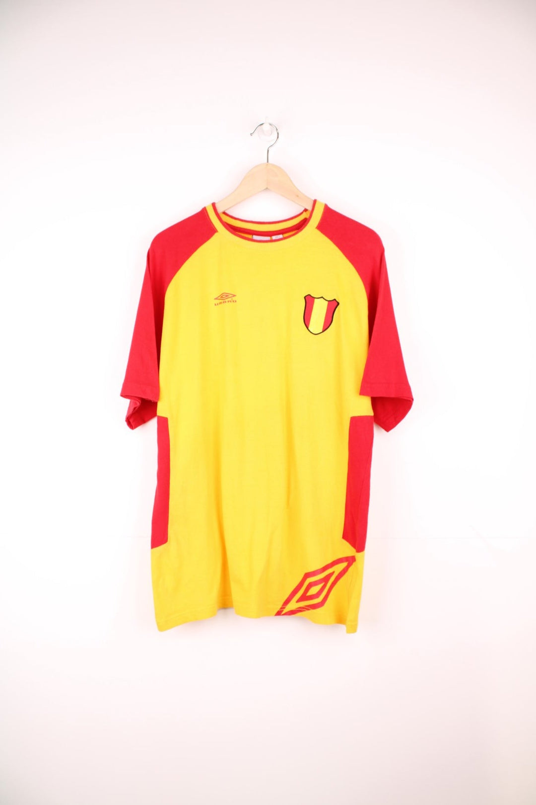 Umbro Spain Football T-Shirt in a yellow and red colourway with the logos printed on the front and on the back is the Spain spell out print.