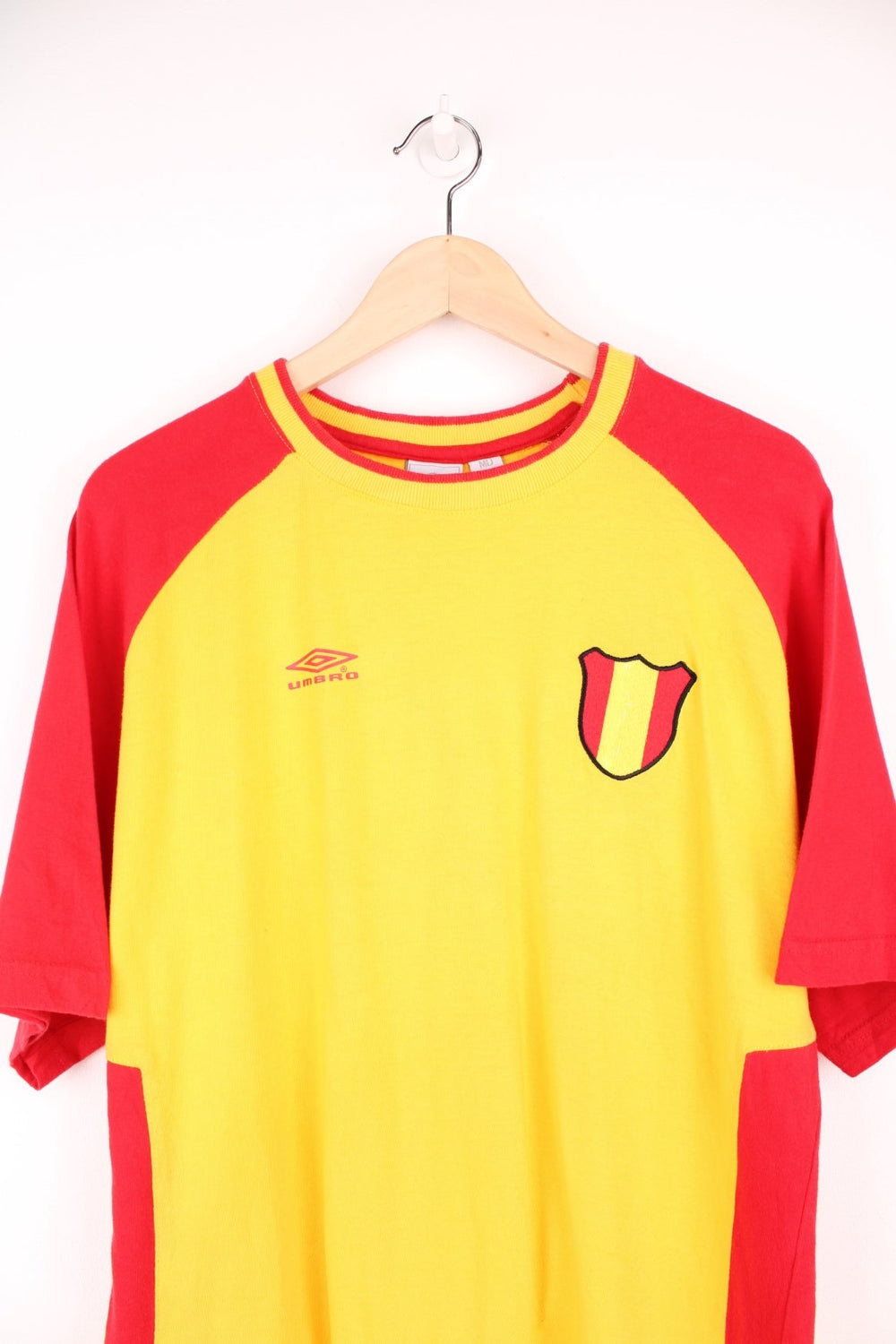 Umbro Spain Football T-Shirt in a yellow and red colourway with the logos printed on the front and on the back is the Spain spell out print.