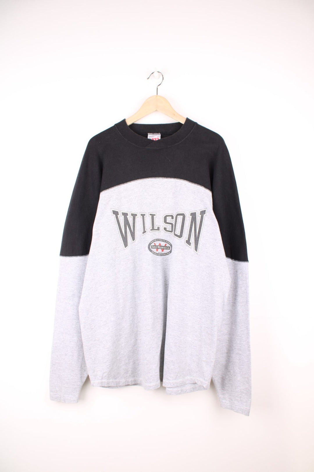 Wilson Athletic Long Sleeved T-Shirt in a grey and black colourway with the spell out logo printed across the front. 