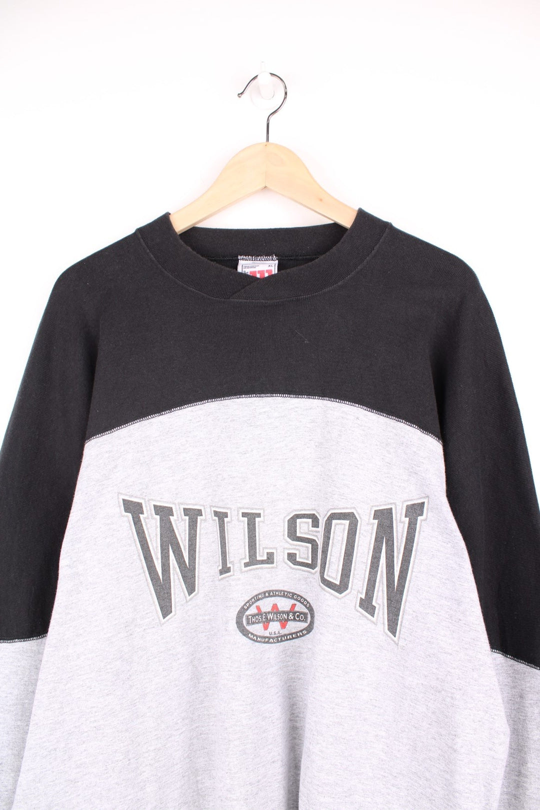 Wilson Athletic Long Sleeved T-Shirt in a grey and black colourway with the spell out logo printed across the front. 