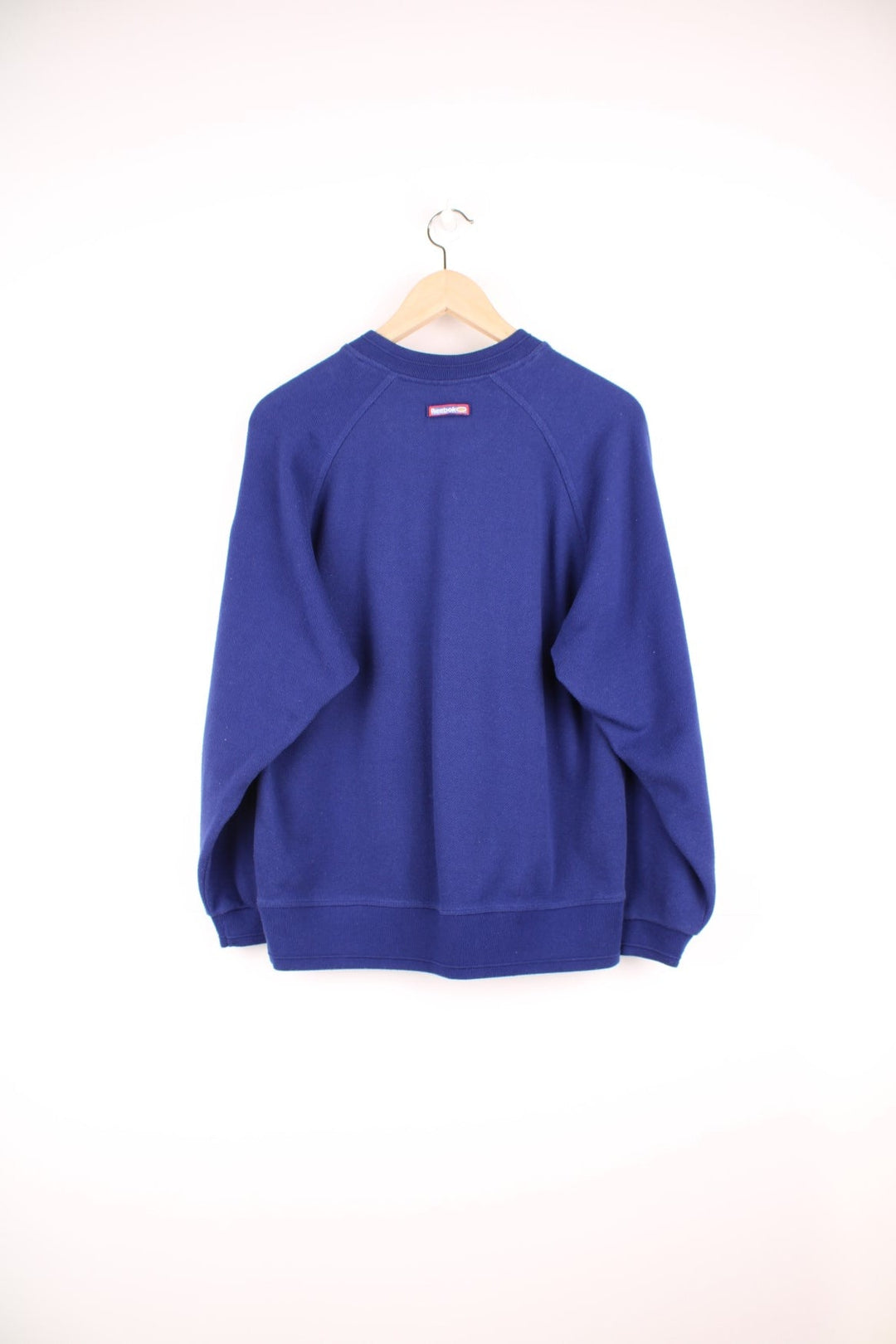 Reebok Freestyle Sweatshirt in a blue colourway with the spell out logo embroidered across the front and on the left sleeve.