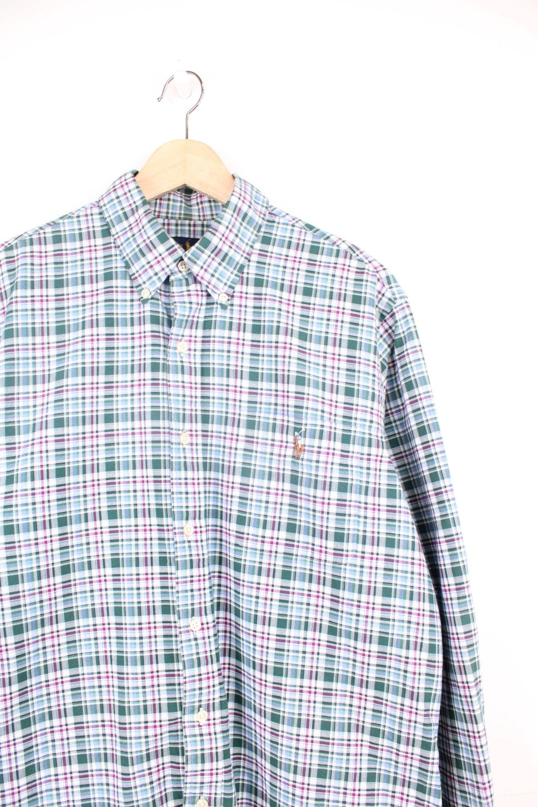 Ralph Lauren Shirt in a green, white and purple plaid colourway, button up, and has a chest pocket with the logo embroidered on it. 