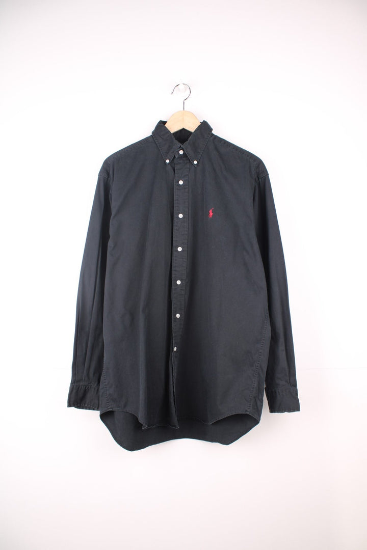 Ralph Lauren Shirt in a plain black colourway, button up and has the logo embroidered in red on the chest.