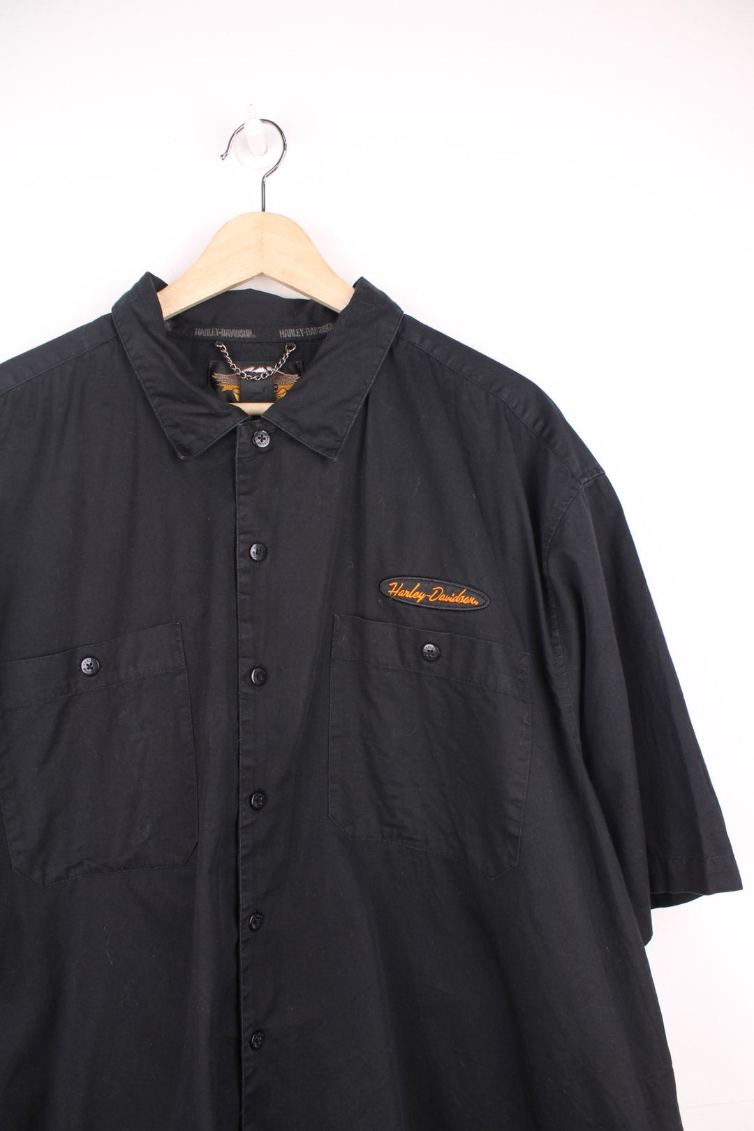 Harley Davidson Work Shirt in a black colourway, short sleeve button up shirt, double chest pockets, and has the logo embroidered on the front, back and right sleeve. 