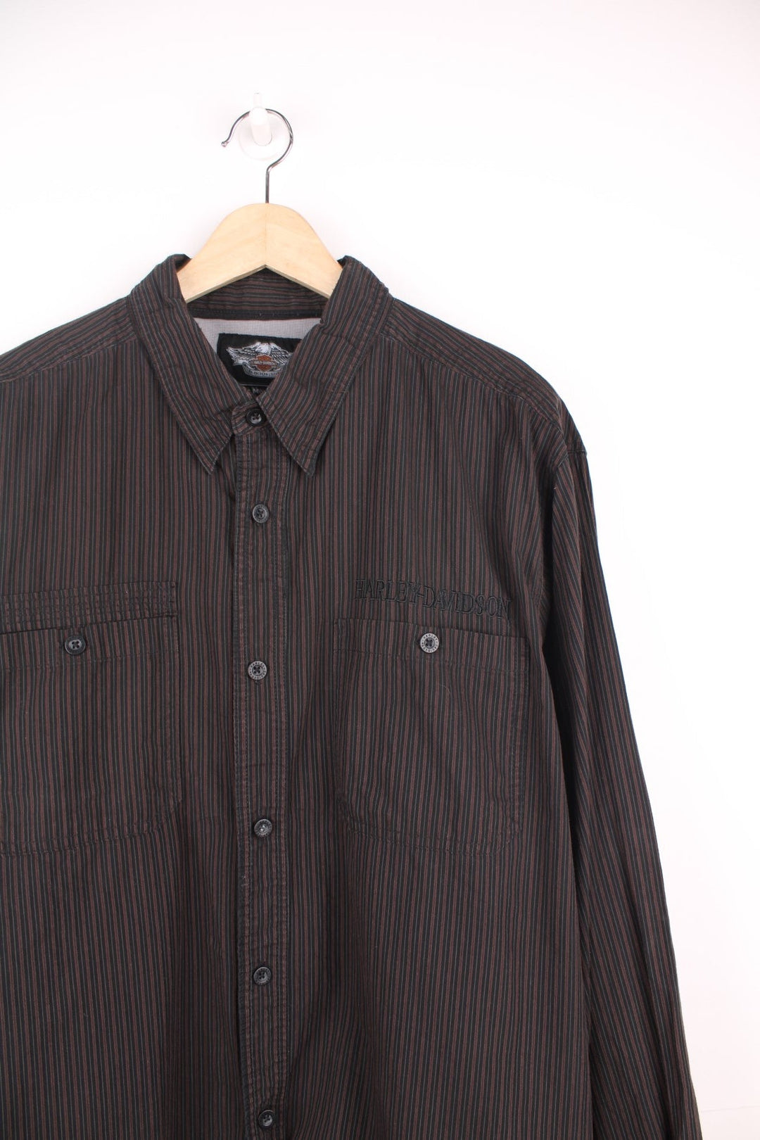 Harley Davidson Shirt in a black and brown striped colourway, button up, has double chest pockets, and the logo embroidered on the front and back. 