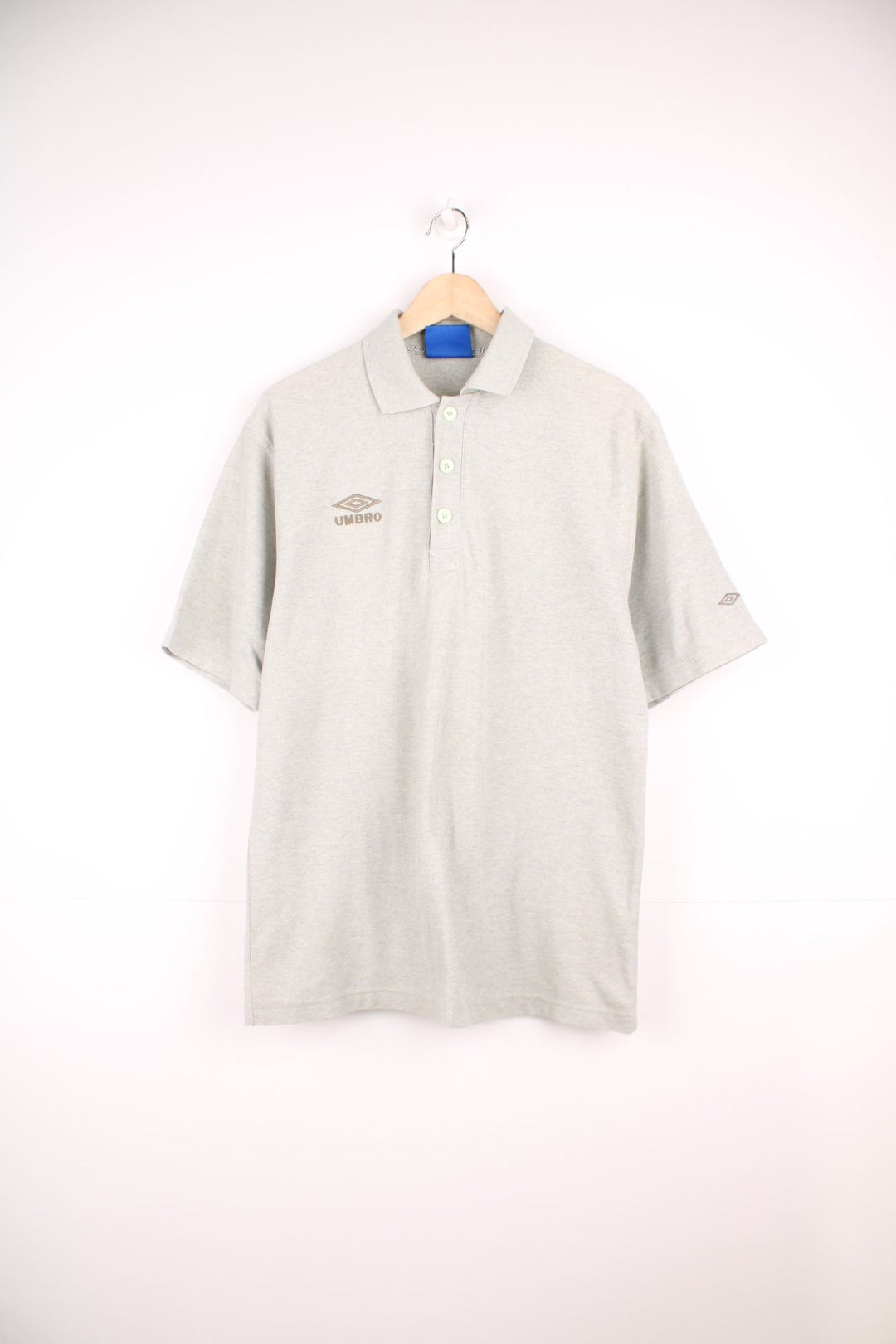 Umbro Polo Shirt in a plain grey colourway, button up and has the logo embroidered on the chest and left sleeve. 