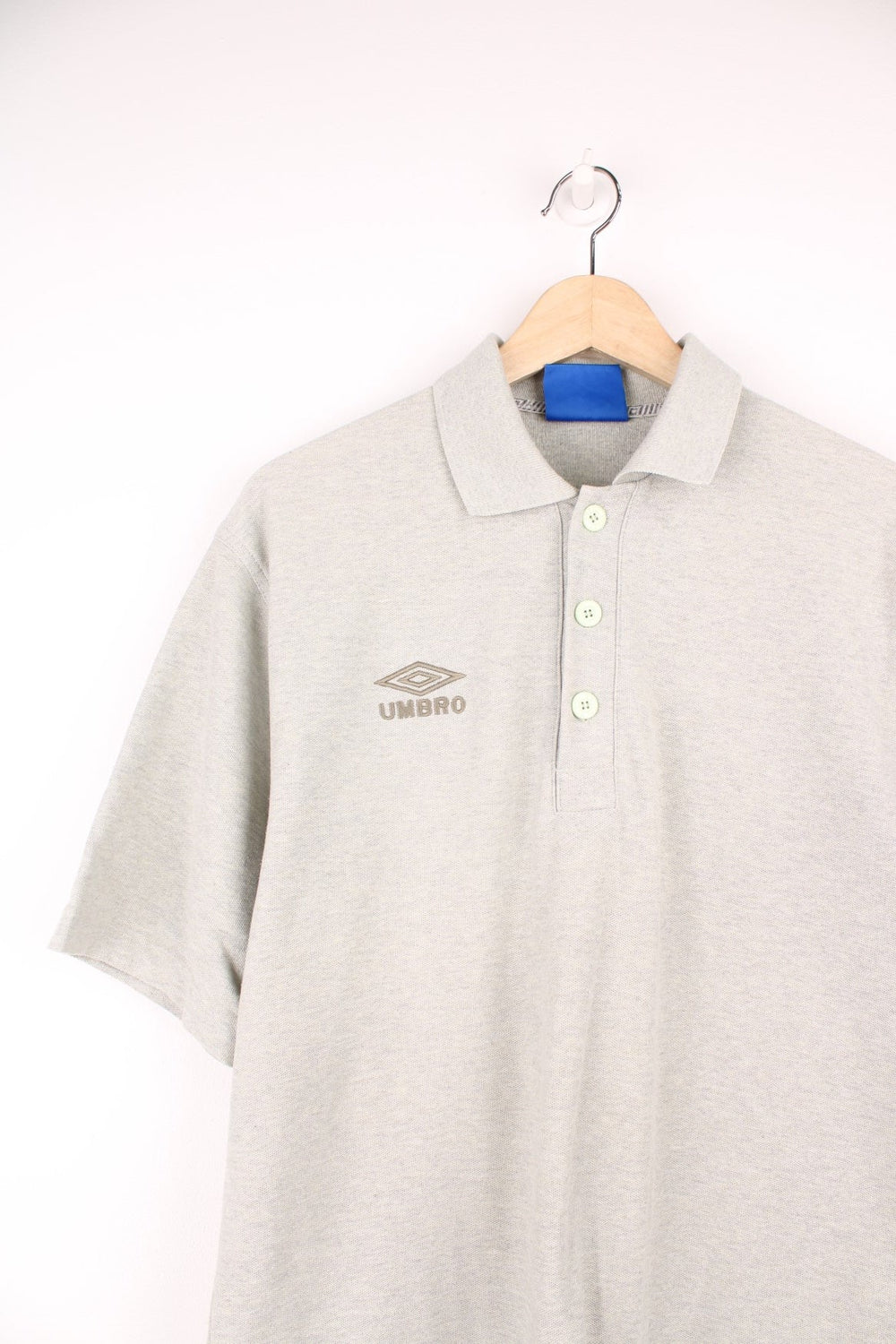 Umbro Polo Shirt in a plain grey colourway, button up and has the logo embroidered on the chest and left sleeve. 