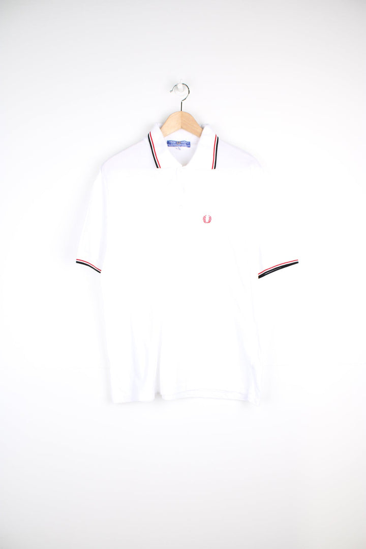 White and red Fred Perry Polo Shirt with embroidered logo on the chest.