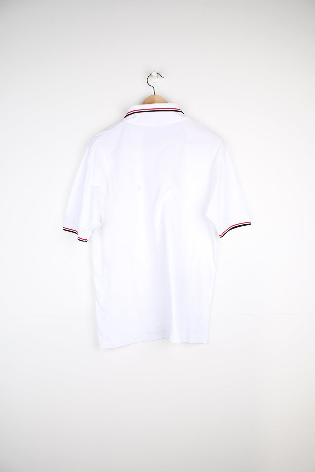 White and red Fred Perry Polo Shirt with embroidered logo on the chest.