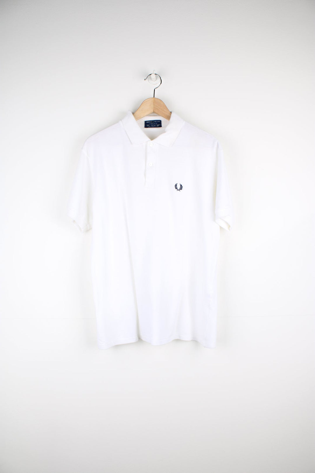 White Fred Perry Polo Shirt with navy embroidered logo on the chest.