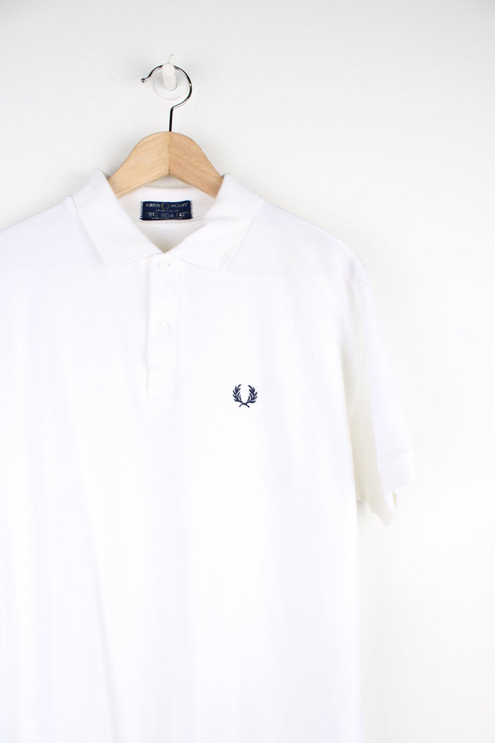 White Fred Perry Polo Shirt with navy embroidered logo on the chest.