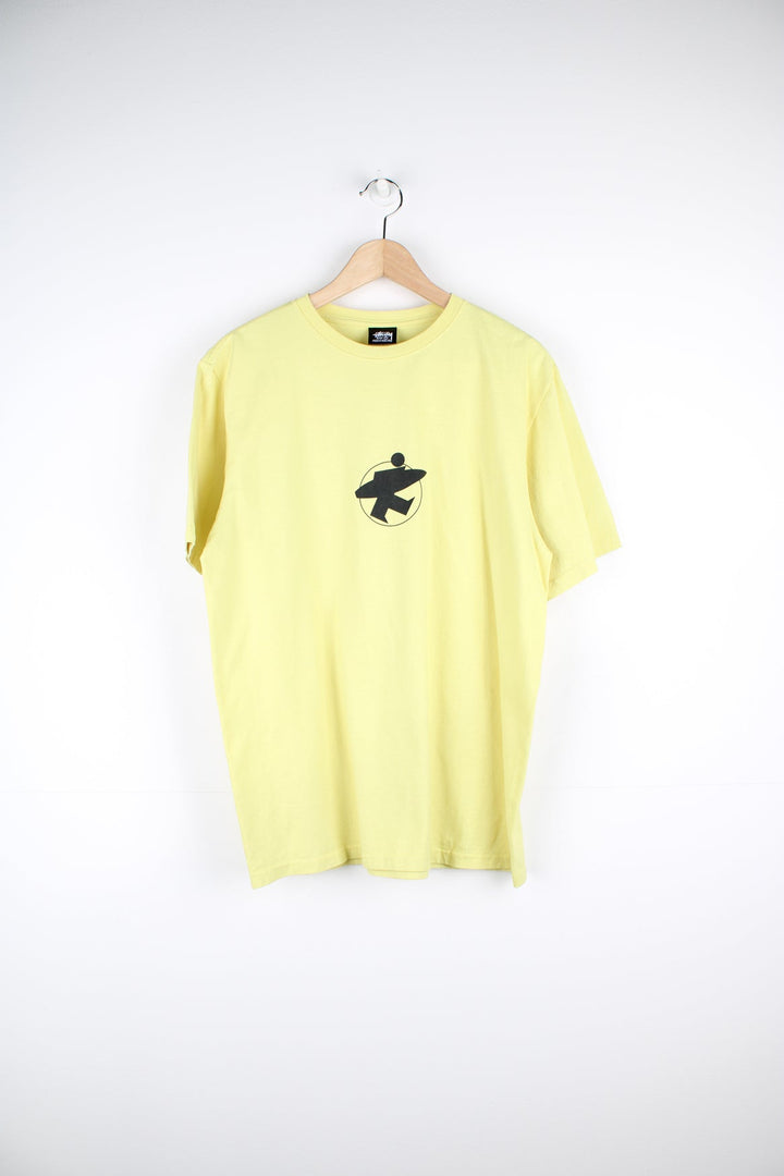 Stussy Surf Stock T-Shirt in yellow with printed logo on the front and back.