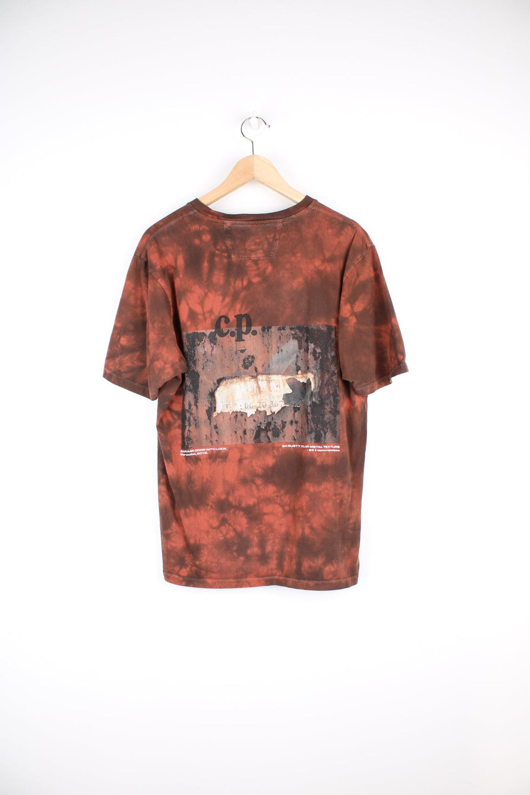 CP Company Next Landscape T-Shirt in red and black tie dye. Features graphic print on the front and back.