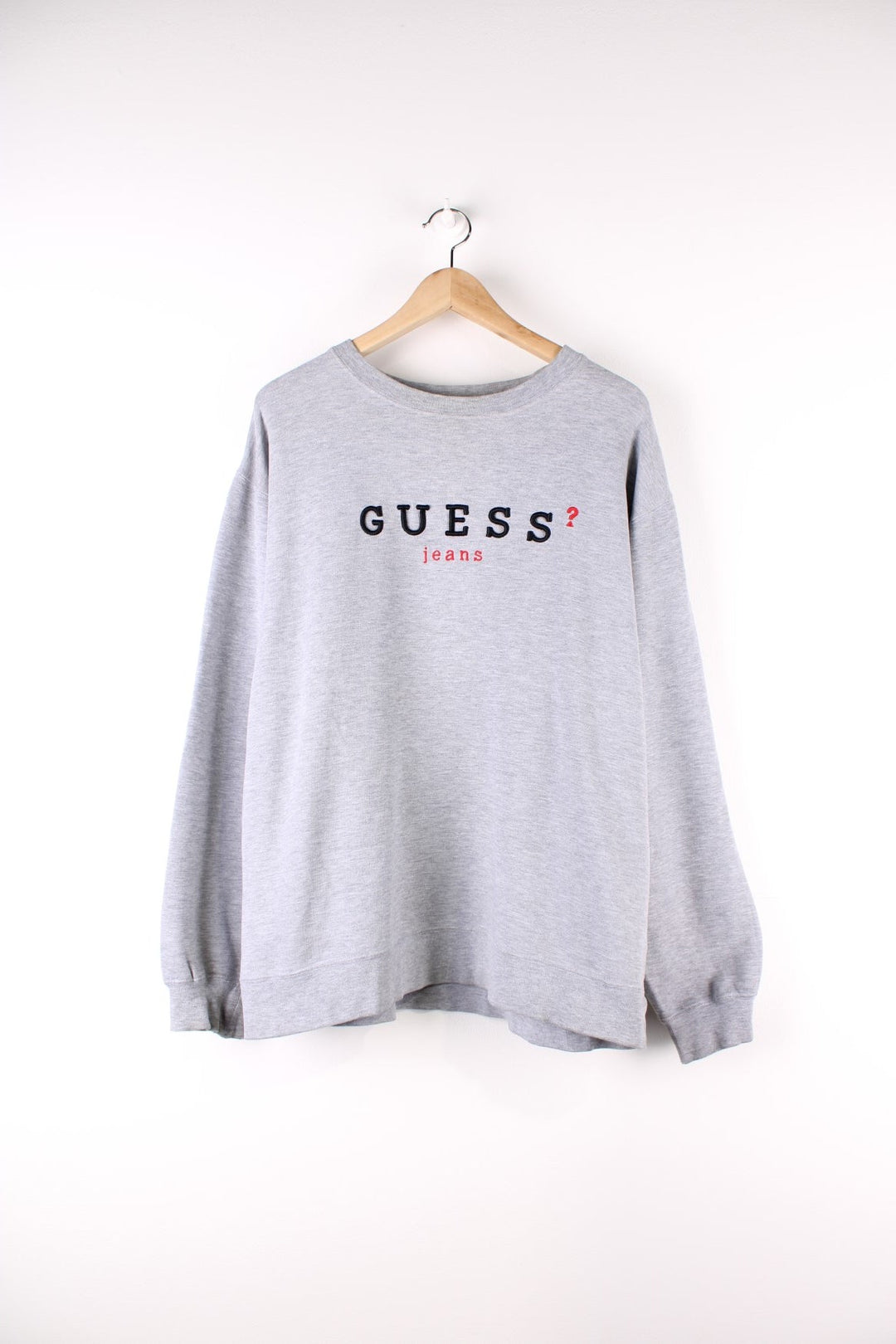 Vintage 90's Guess Sweatshirt in a grey colourway with the spell out embroidered on the front.