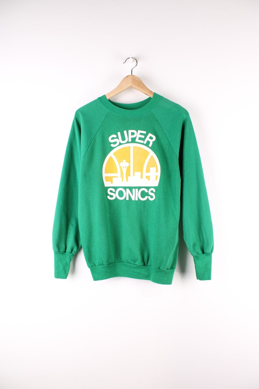 Vintage 80's Logo 7 Seattle Supersonics NBA Sweatshirt in a green colourway with the logo and spell out printed on front.