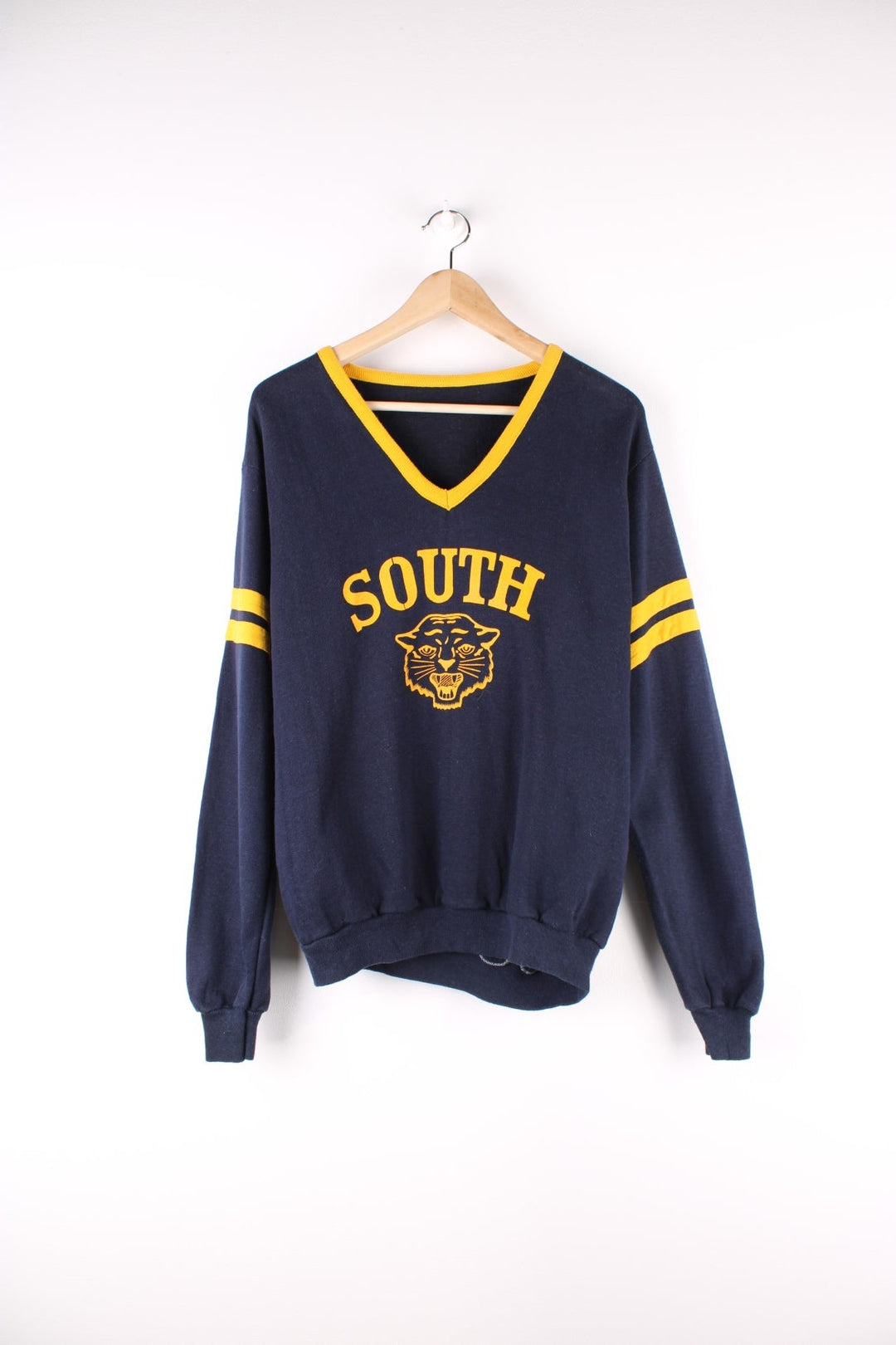 Vintage Southern Wild Cats College Sweatshirt in a blue and yellow colourway with the logo and spell out printed on the front.