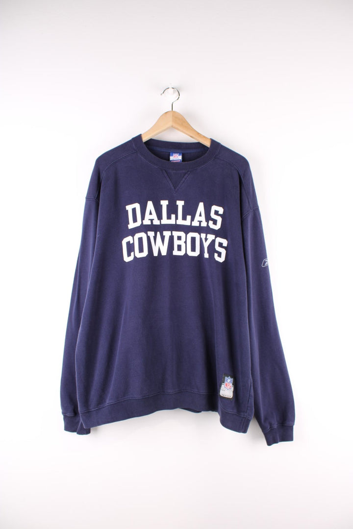 Dallas Cowboys NFL Reebok Sweatshirt in a blue colourway with the team spell out printed across the front.