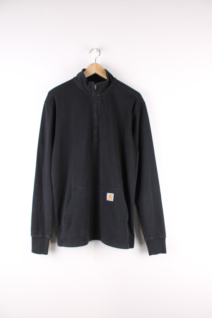 Carhartt Quarter Zip Sweatshirt in a black colourway with the logo embroidered on the front pouch pocket.