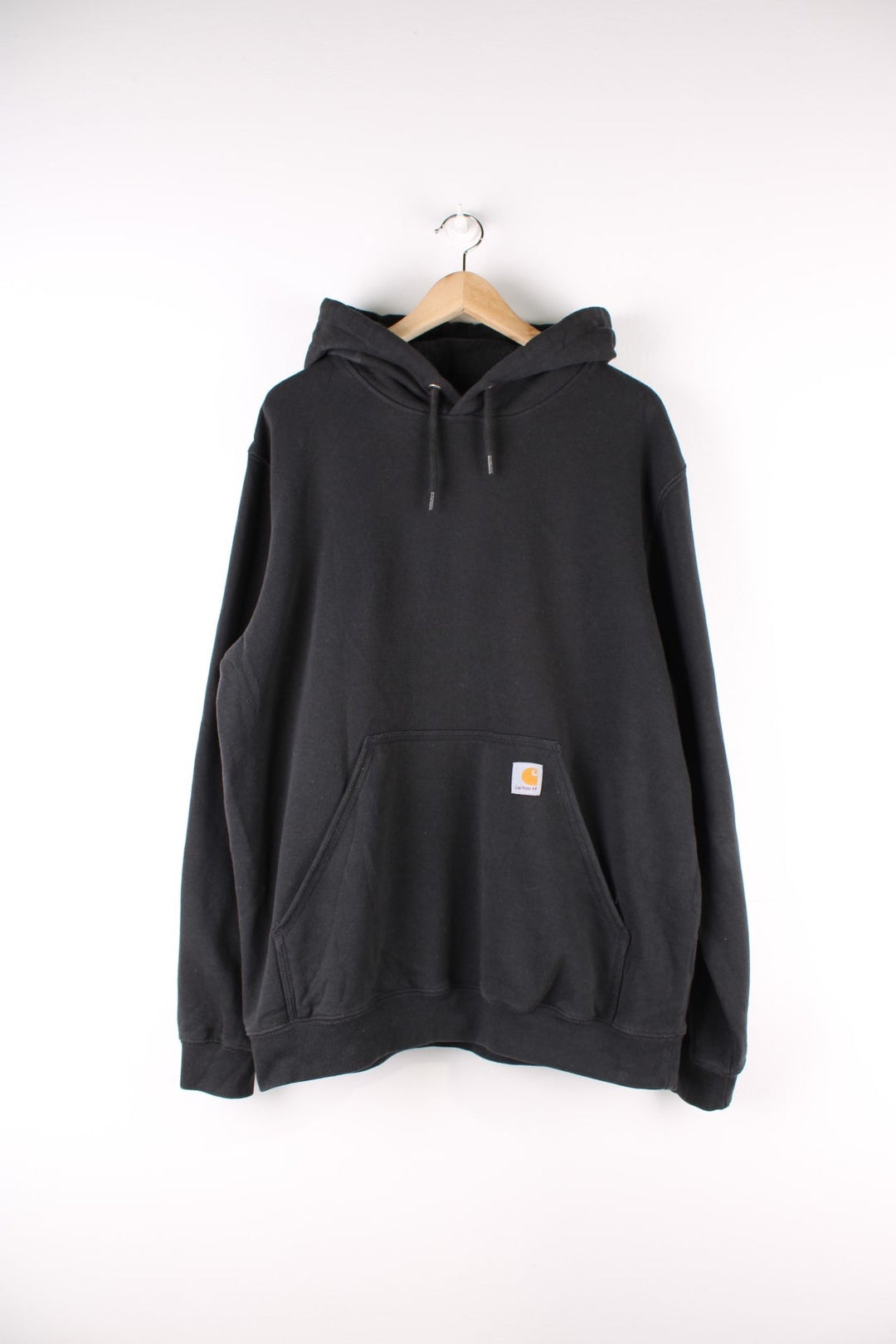 Carhartt Hoodie in a black colourway with the logo embroidered on the front pocket and spell out printed down the left sleeve.