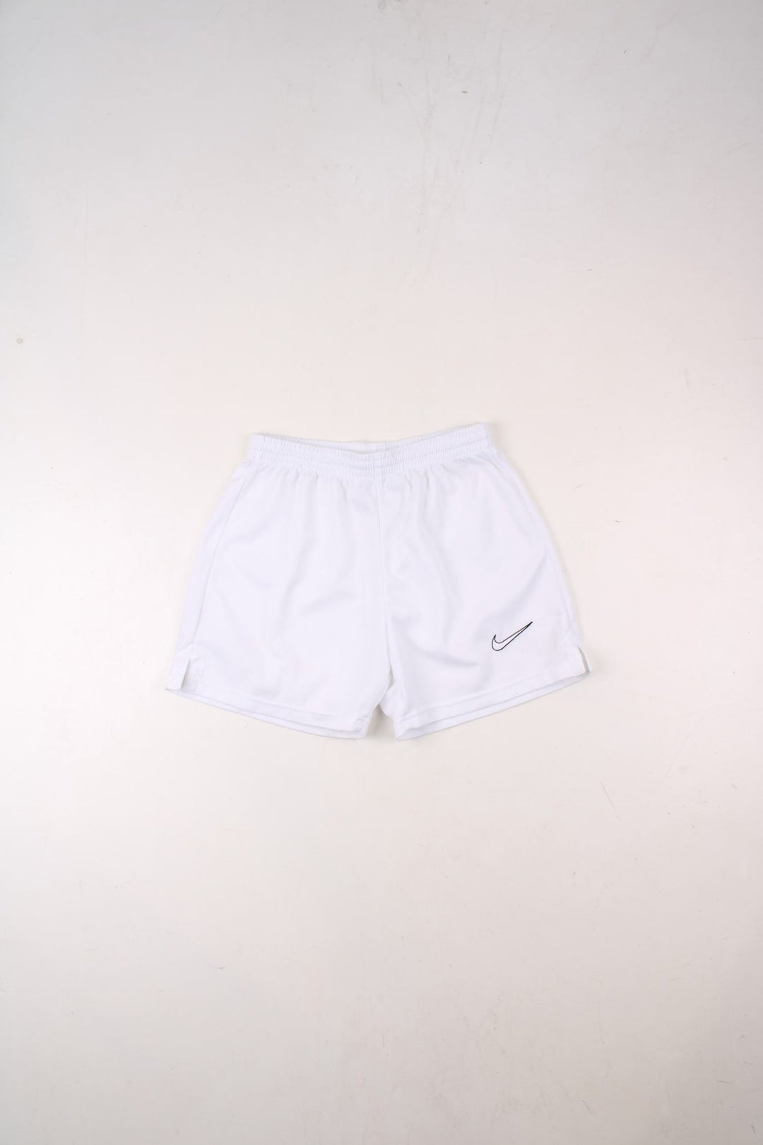 Nike shorts in white with an elasticated waist, and an embroidered logo on the front.