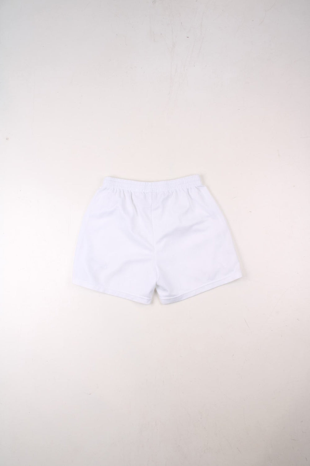 Nike shorts in white with an elasticated waist, and an embroidered logo on the front.