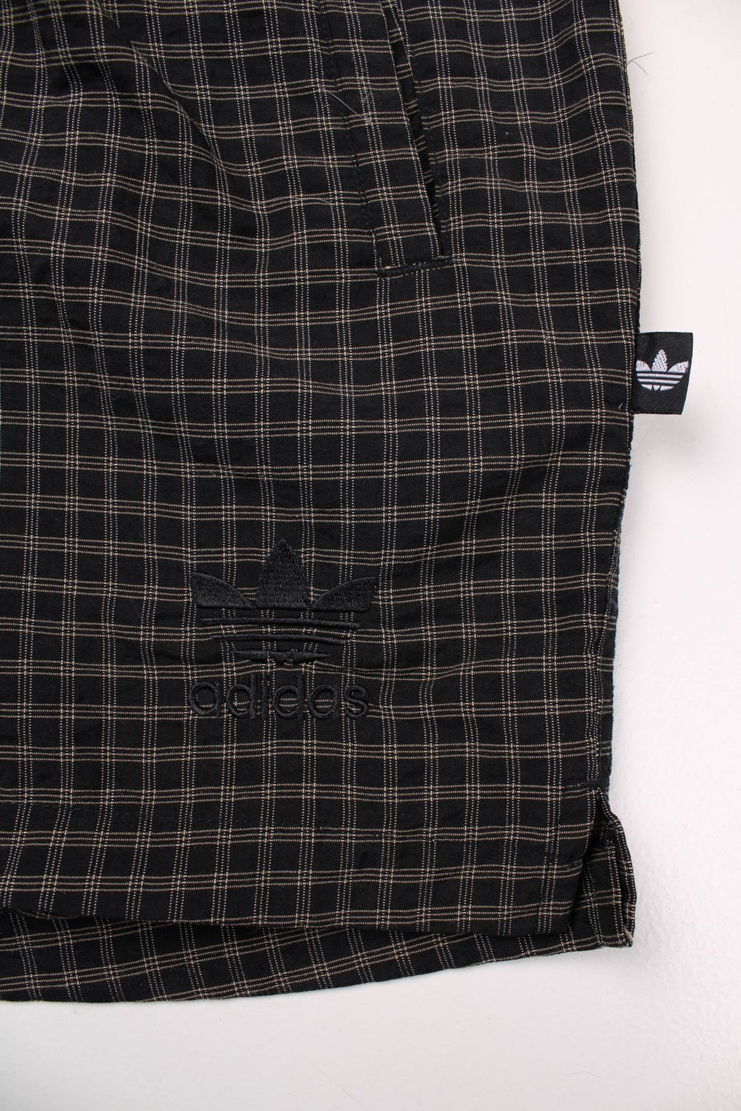 Adidas check shorts in black with an elasticated waist and embroidered trefoil logo.