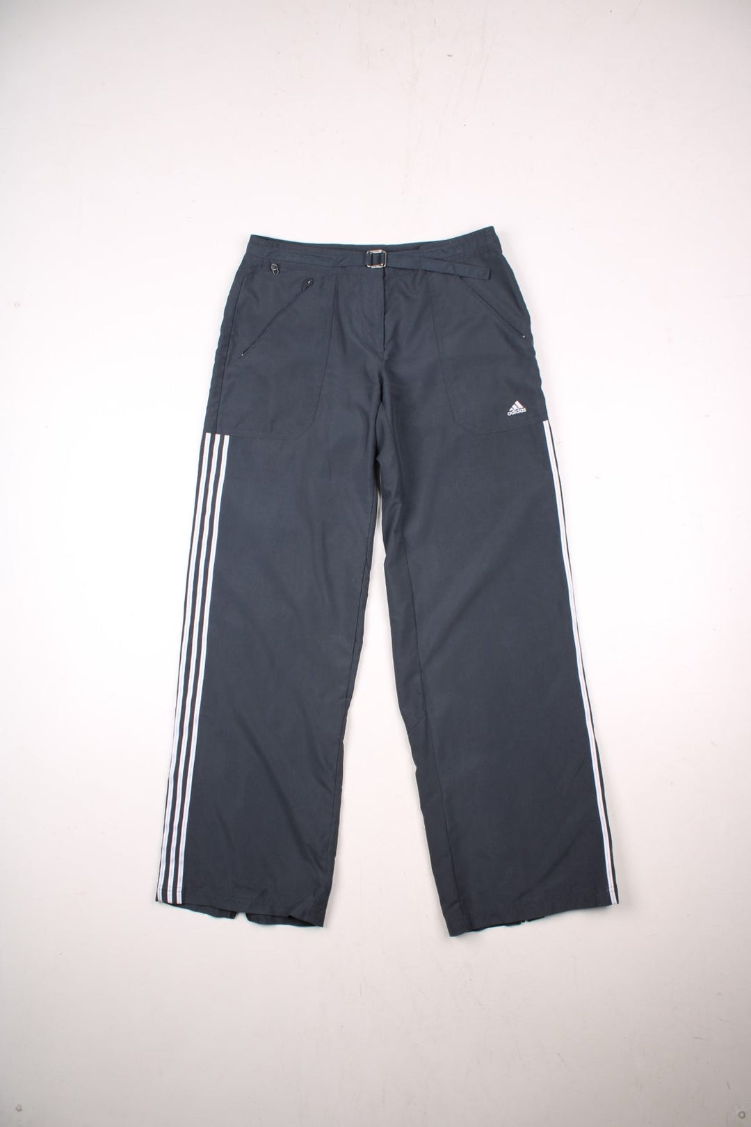 Adidas tracksuit bottoms in grey with white three-stripe, attached belt detail, four pockets and an embroidered logo.