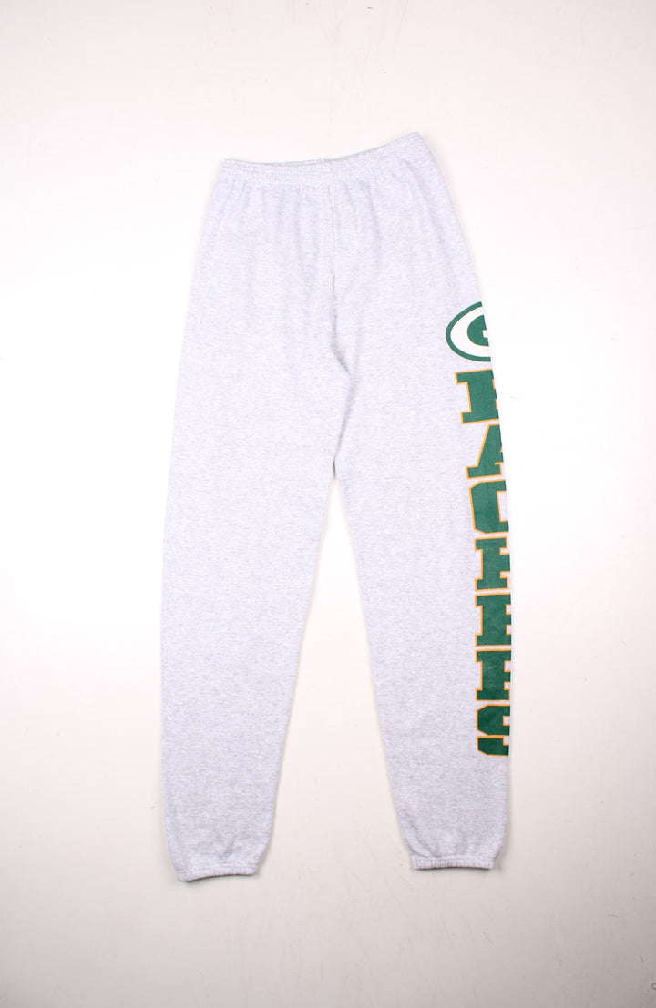 Green Bay Packers NFL tracksuit joggers in grey marl with an elasticated waist, and a printed spellout in green and yellow along the left leg.