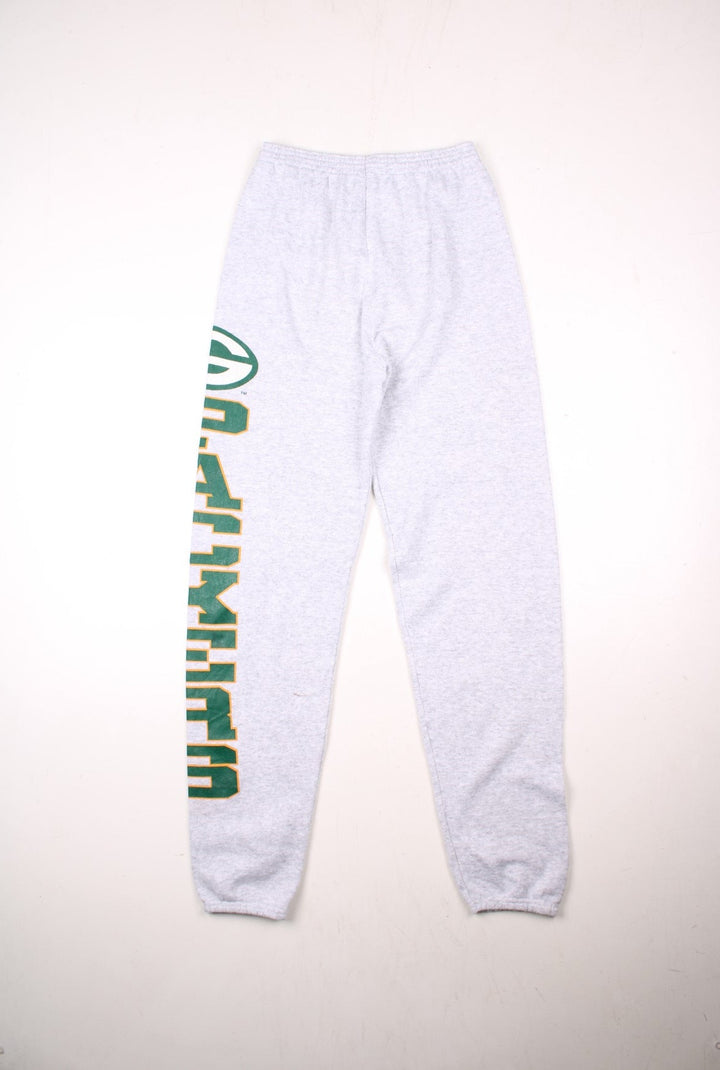 Green Bay Packers NFL tracksuit joggers in grey marl with an elasticated waist, and a printed spellout in green and yellow along the left leg.