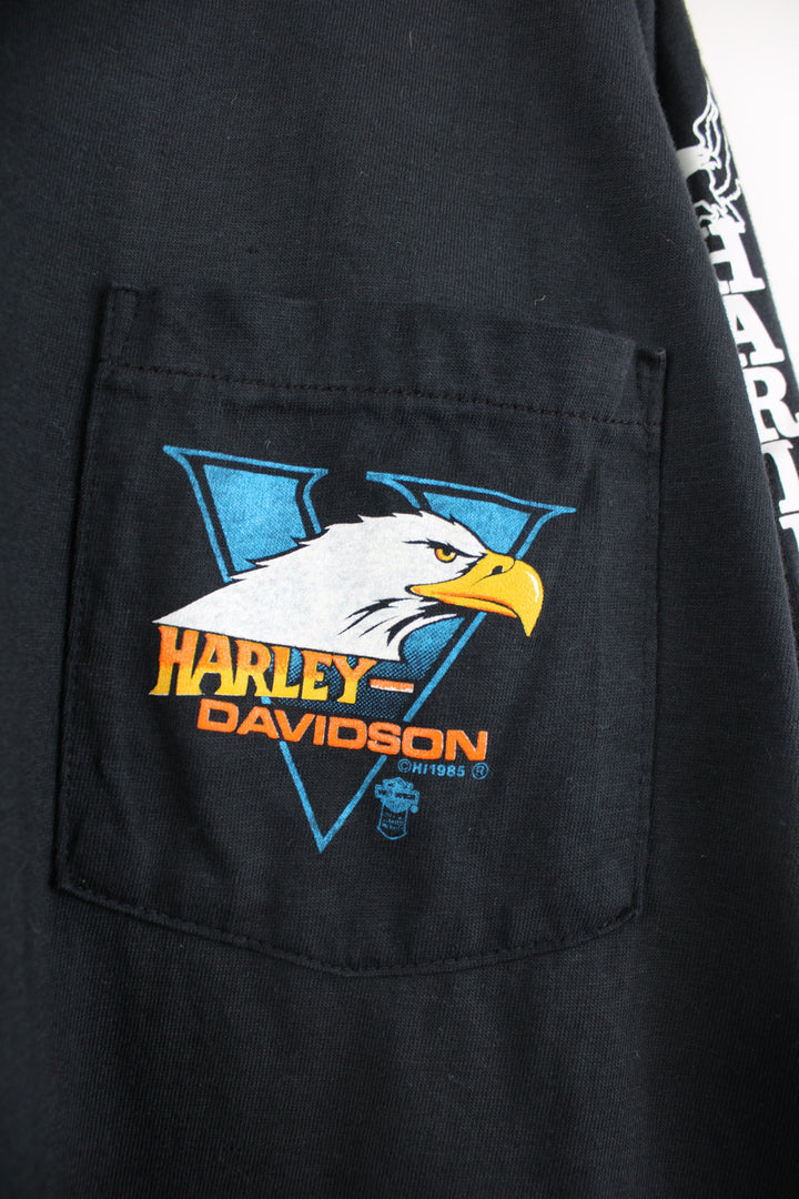 Vintage made in the USA 1980's Harley-Davidson Stockton California all black long sleeve top with printed spell-out graphics on the back and down the sleeves, eagle on the chest pocket