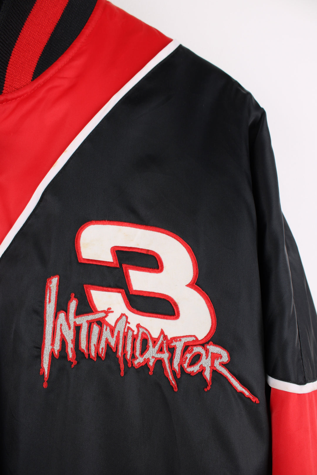 NASCAR's Dale Earnhardt #3 'Intimidator' red and black racing jacket, features embroidered spell-out details  