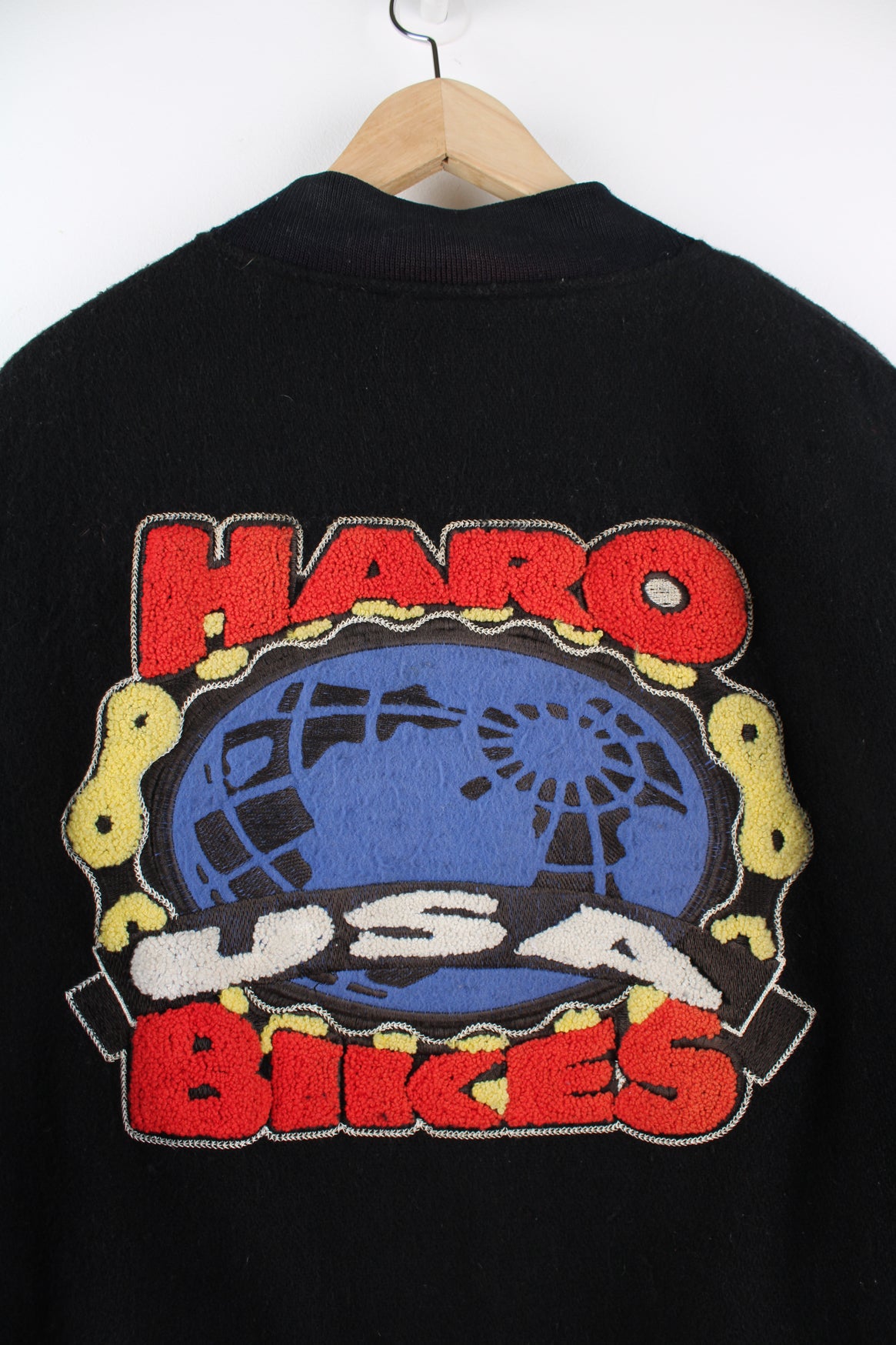 Vintage HARO BMX Bikes, black wool embroidered varsity jacket with red leather sleeves, features spell-out embroidery on the sleeve, chest and back of jacket