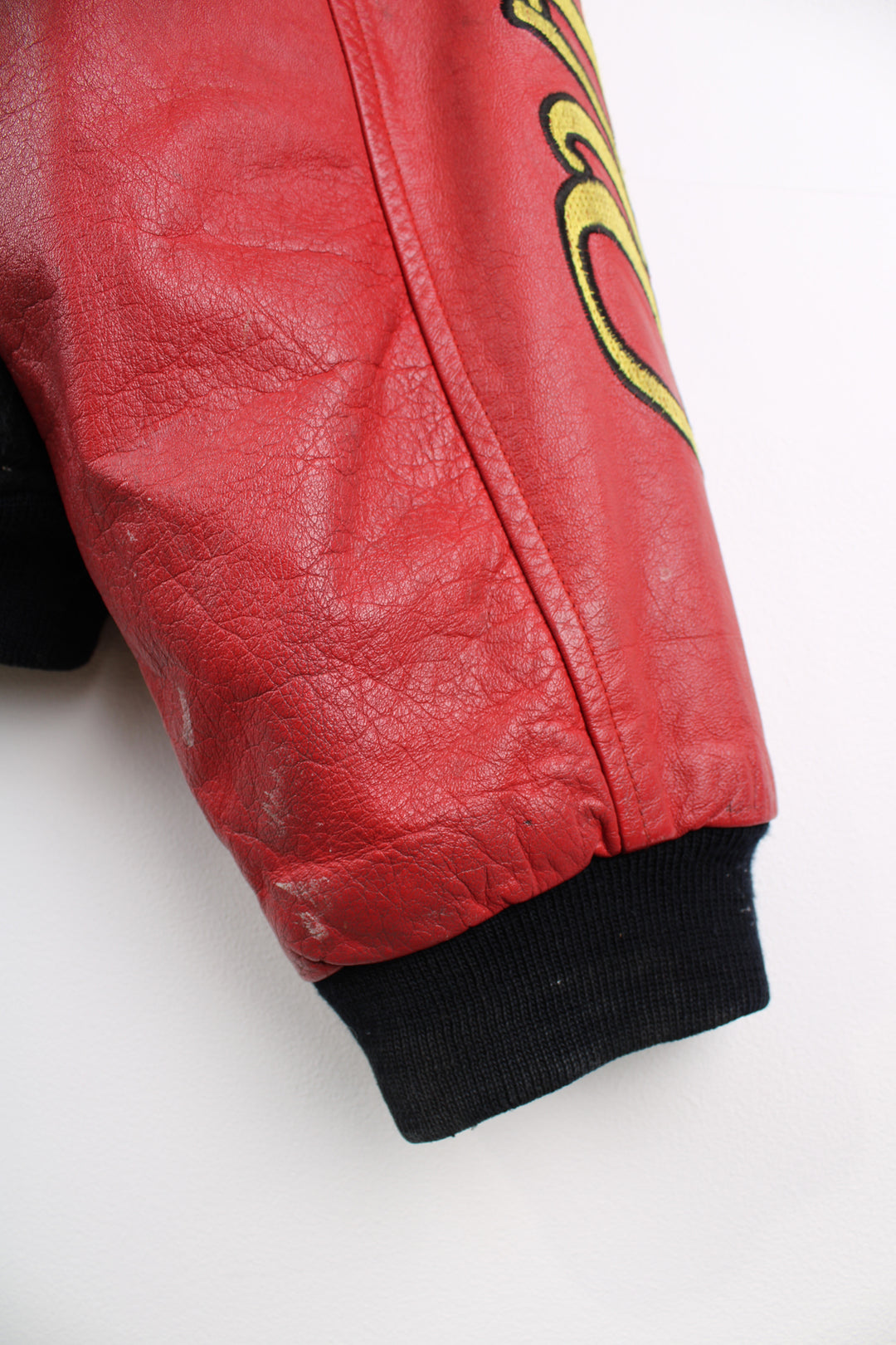 Vintage HARO BMX Bikes, black wool embroidered varsity jacket with red leather sleeves, features spell-out embroidery on the sleeve, chest and back of jacket