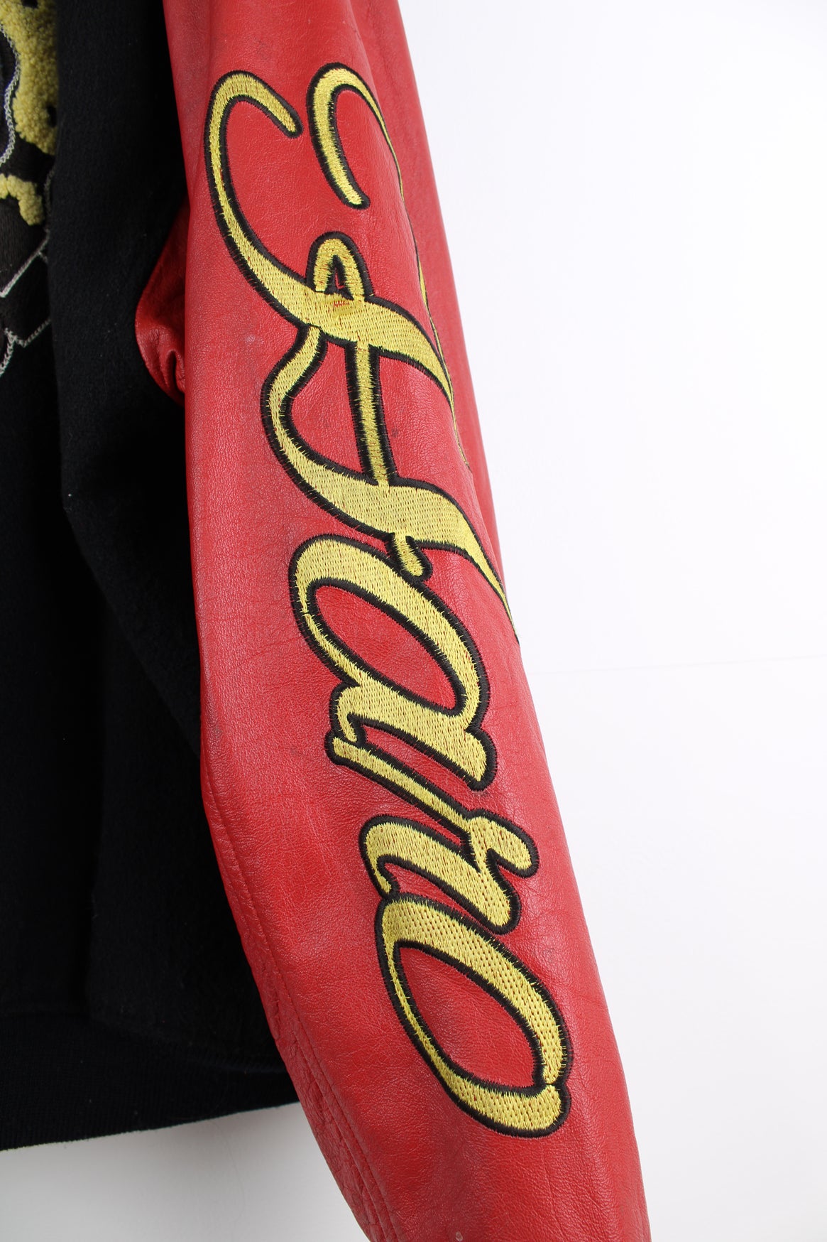 Vintage HARO BMX Bikes, black wool embroidered varsity jacket with red leather sleeves, features spell-out embroidery on the sleeve, chest and back of jacket