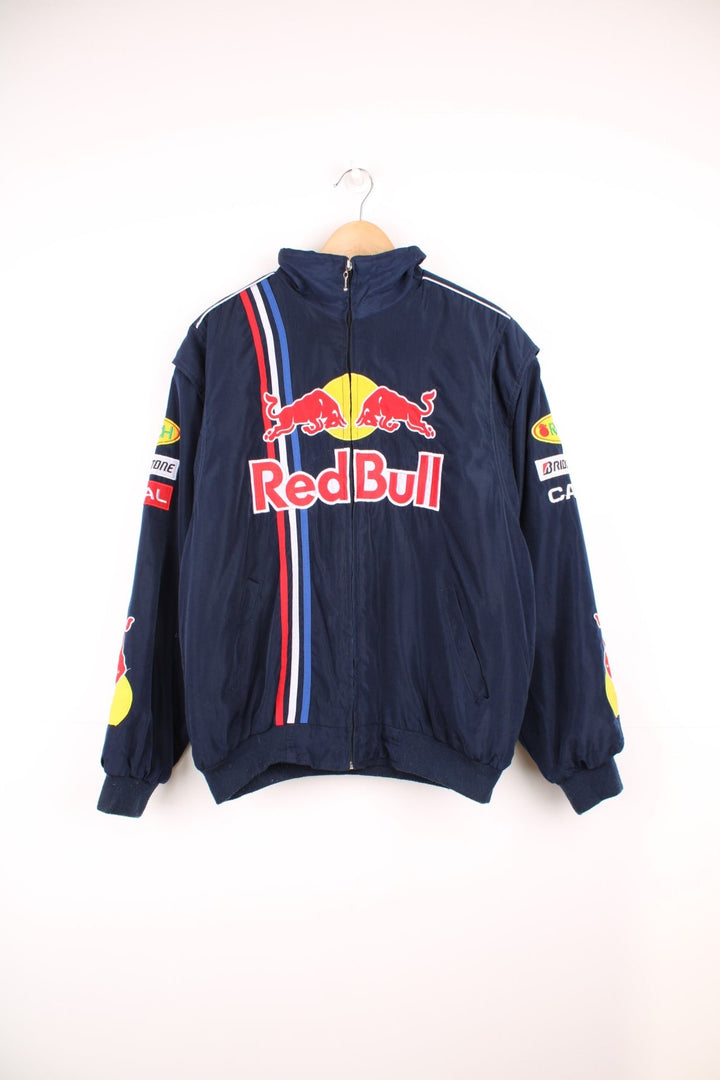 Vintage 90s/Y2K Red Bull, Formula 1, Sauber Petronas zip through racing jacket in navy blue. Features embroidered badges and logo across the chest.