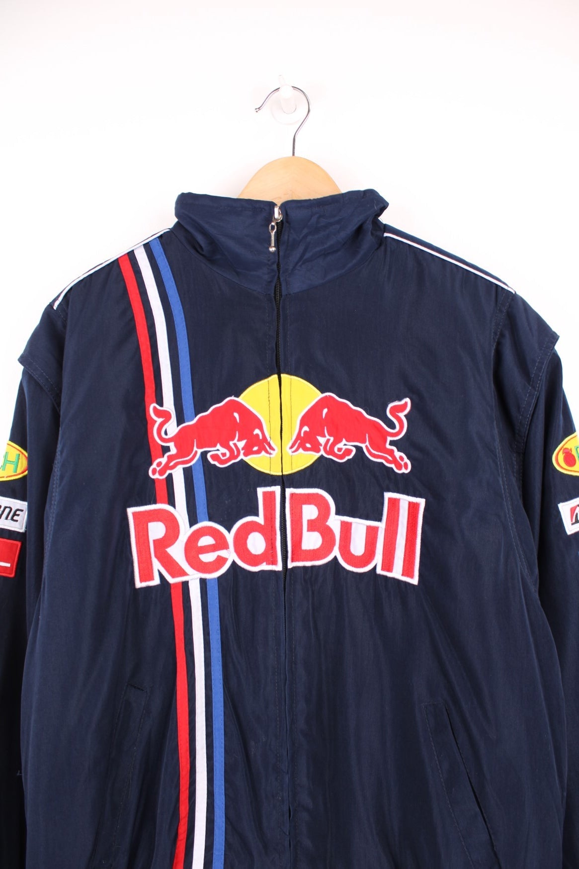 Vintage 90s/Y2K Red Bull, Formula 1, Sauber Petronas zip through racing jacket in navy blue. Features embroidered badges and logo across the chest.