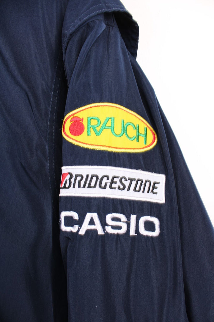 Vintage 90s/Y2K Red Bull, Formula 1, Sauber Petronas zip through racing jacket in navy blue. Features embroidered badges and logo across the chest.