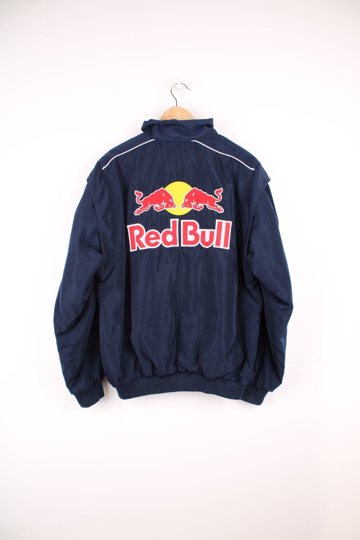 Vintage 90s/Y2K Red Bull, Formula 1, Sauber Petronas zip through racing jacket in navy blue. Features embroidered badges and logo across the chest.