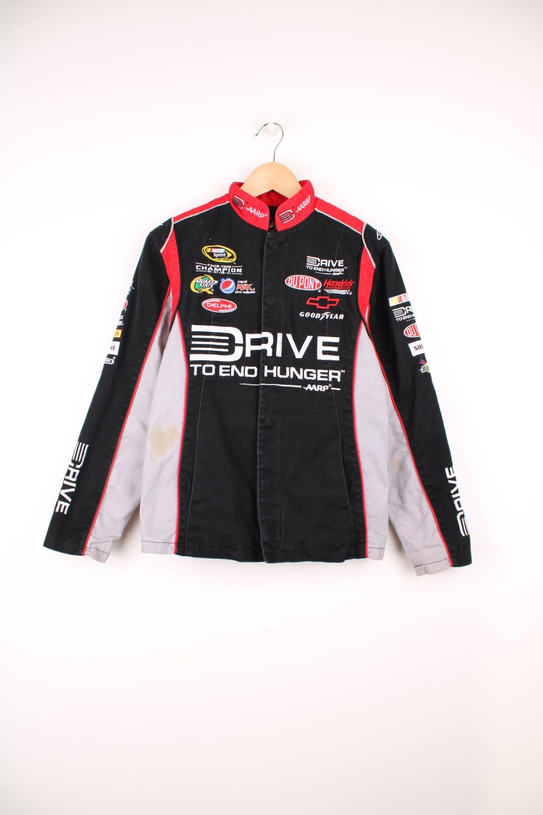 Jeff Gordon Drive To End Hunger NASCAR jacket by Chase Authentics in black, grey and red. Features embroidered sponsor logos on the front and sleeves.