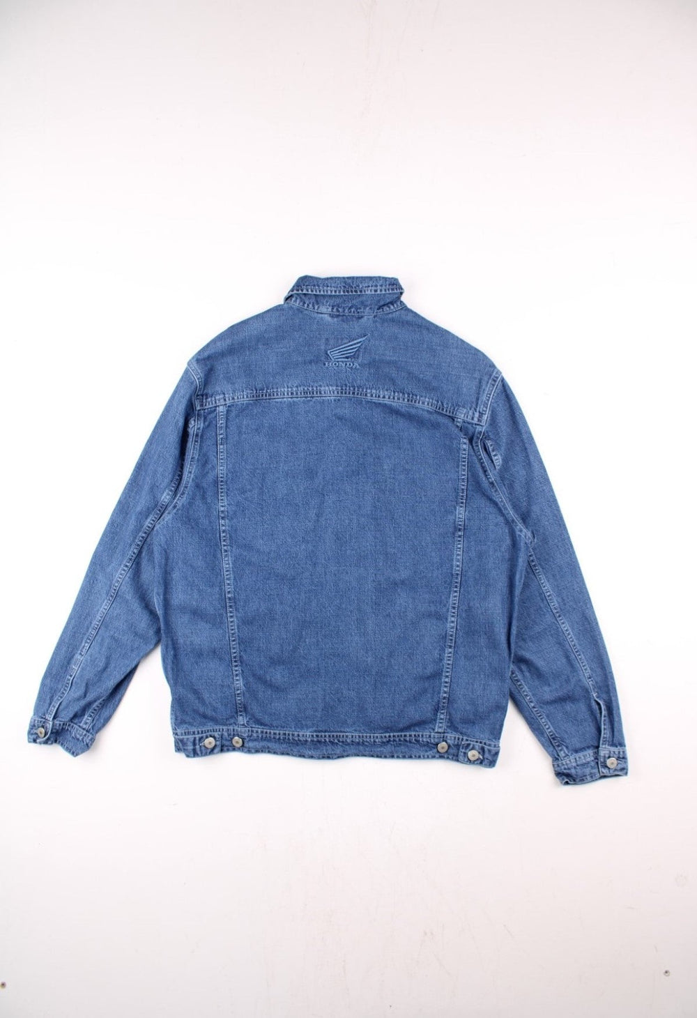 Vintage Honda denim jacket in blue, with multiple pockets, button closure, and the Honda logo embroidered on the chest and back.