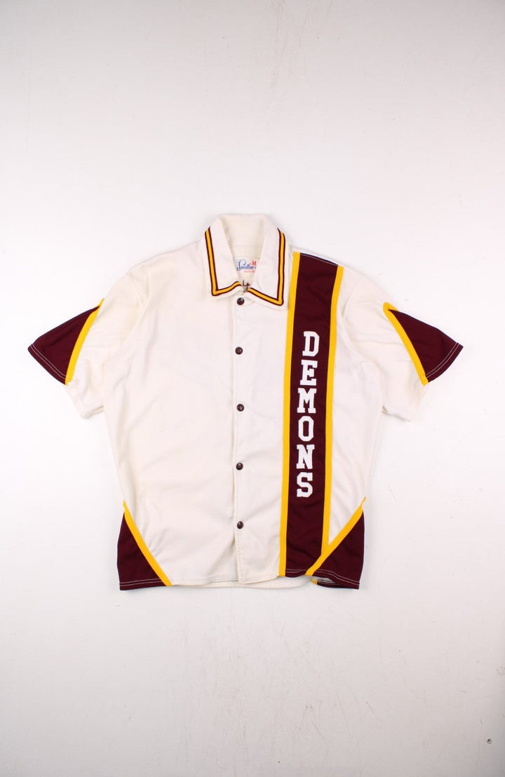 Vintage 60's Bismarck High School Demons shirt in white with burguny and yellow stripes, snap closure, and team logo embroidery front and back.